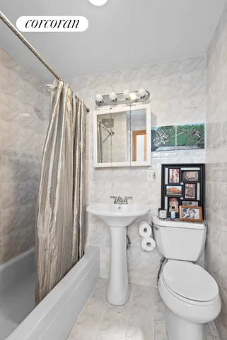 a bedroom with furniture and a flat screen tv