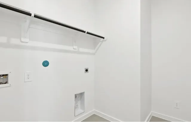 a view of staircase with white walls