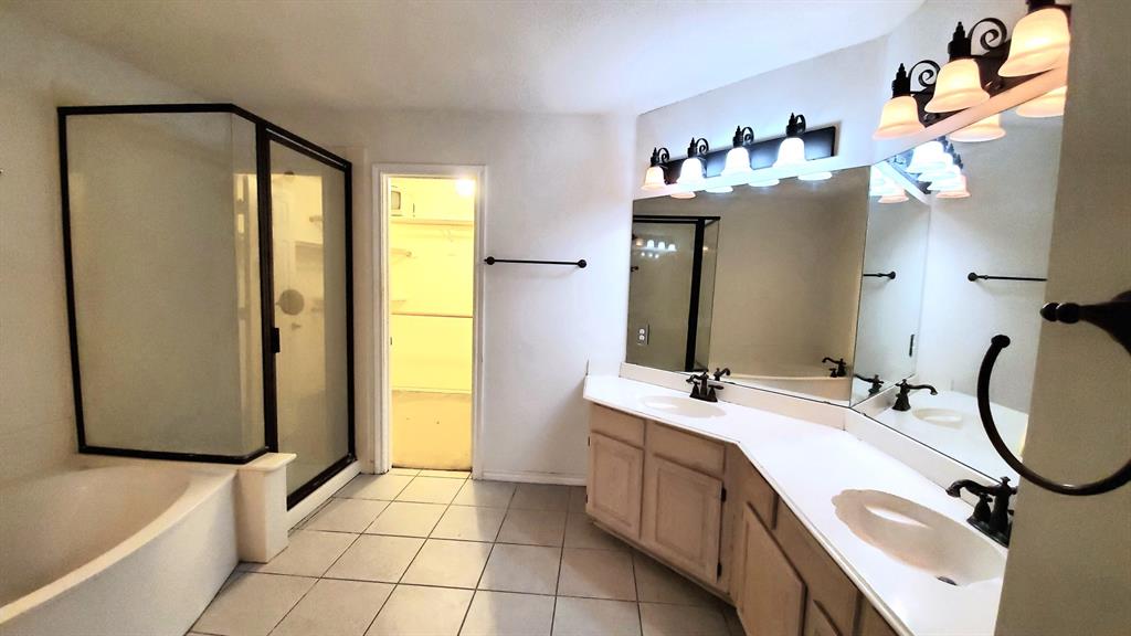 8017 Clipper Street Frisco, TX 75035 - Photo 14 of 21 a bathroom with a double vanity sink mirror and tub