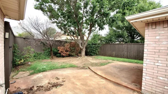 a backyard of a house with lots of green space