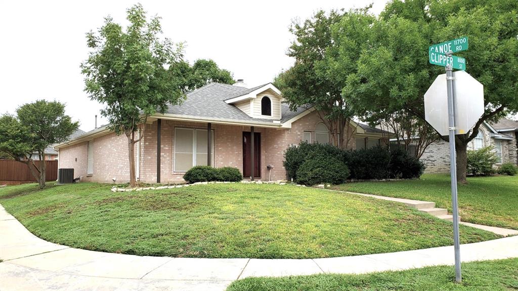 8017 Clipper Street Frisco, TX 75035 - Photo 2 of 21 a front view of a house with a yard