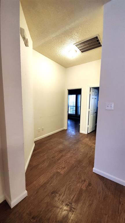 8017 Clipper Street Frisco, TX 75035 - Photo 3 of 21 a view of a big room with wooden floor and windows
