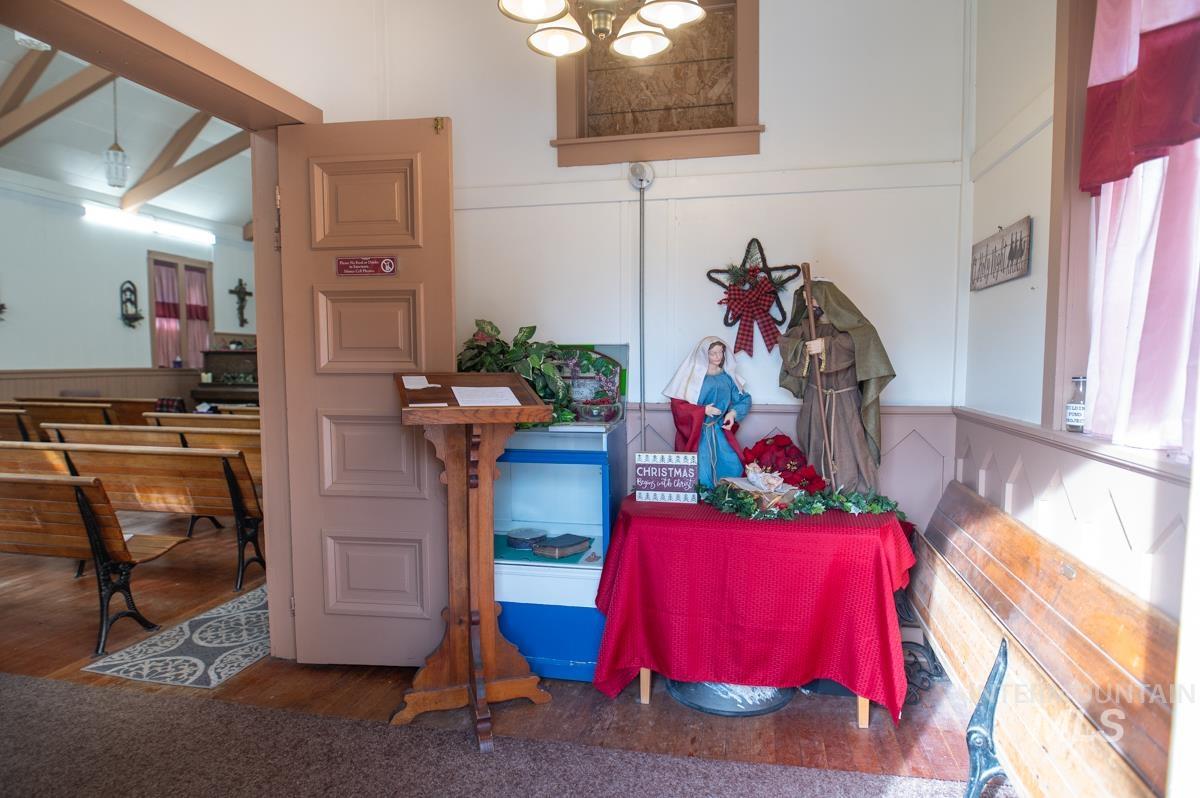 736 East Main Street Weiser, ID 83672 - Photo 8 of 33 Dining room with wood finished floors, a decorative wall, and a wainscoted wall
