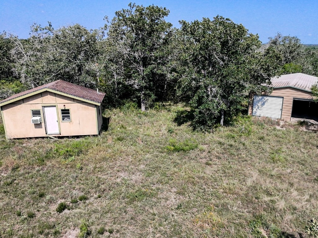 502 Robertson Road Smiley, TX 78159 - Photo 10 of 31 a backyard of a house with lots of green space
