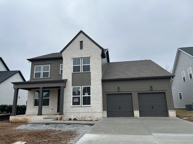 a front view of a house with yard