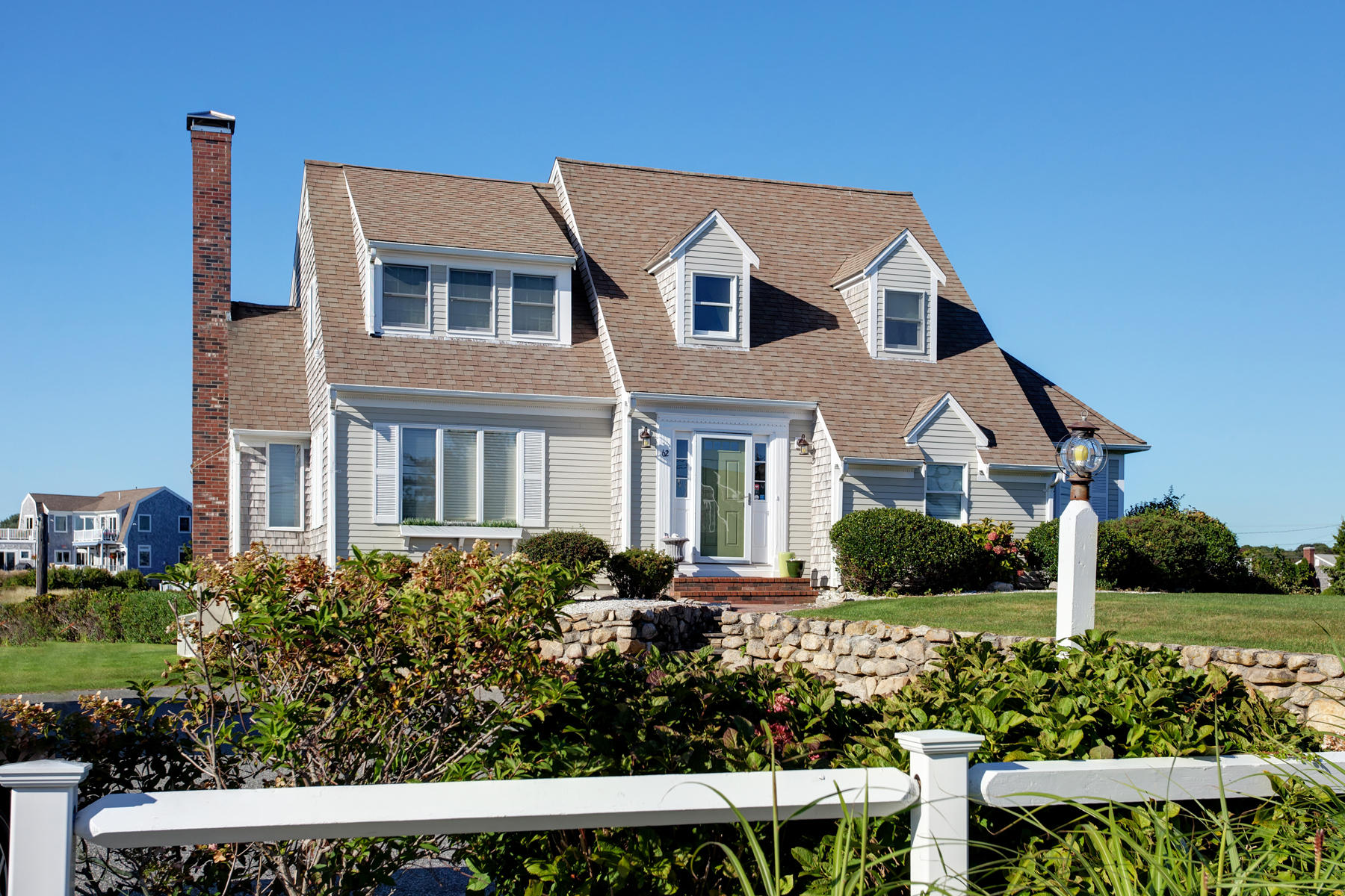 62 Long Beach Road Centerville, MA 02632 - Photo 1 of 27 a front view of a house with a yard
