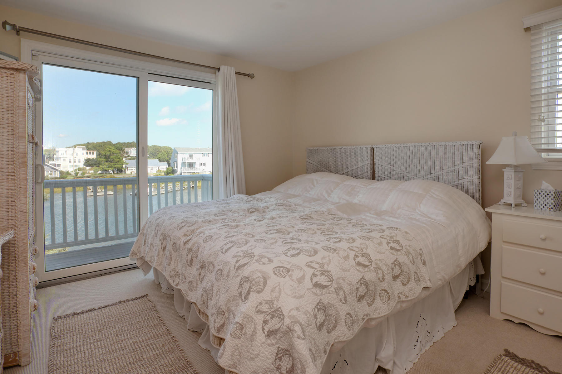 62 Long Beach Road Centerville, MA 02632 - Photo 18 of 27 a large bed sitting in a bedroom next to a window