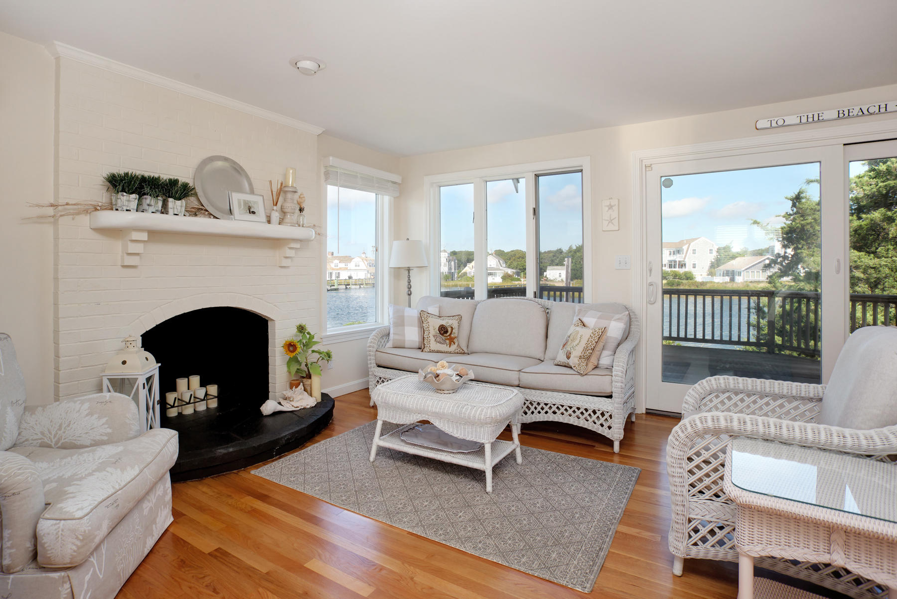 62 Long Beach Road Centerville, MA 02632 - Photo 9 of 27 a living room with furniture and a fireplace