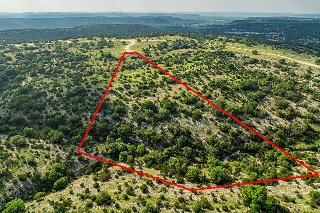 Lot 33 Spring Bluff Junction Junction, TX 76849 - Photo 15 of 19 a view of a yard with an umbrella