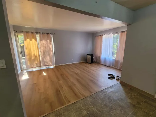 a view of an empty room and window