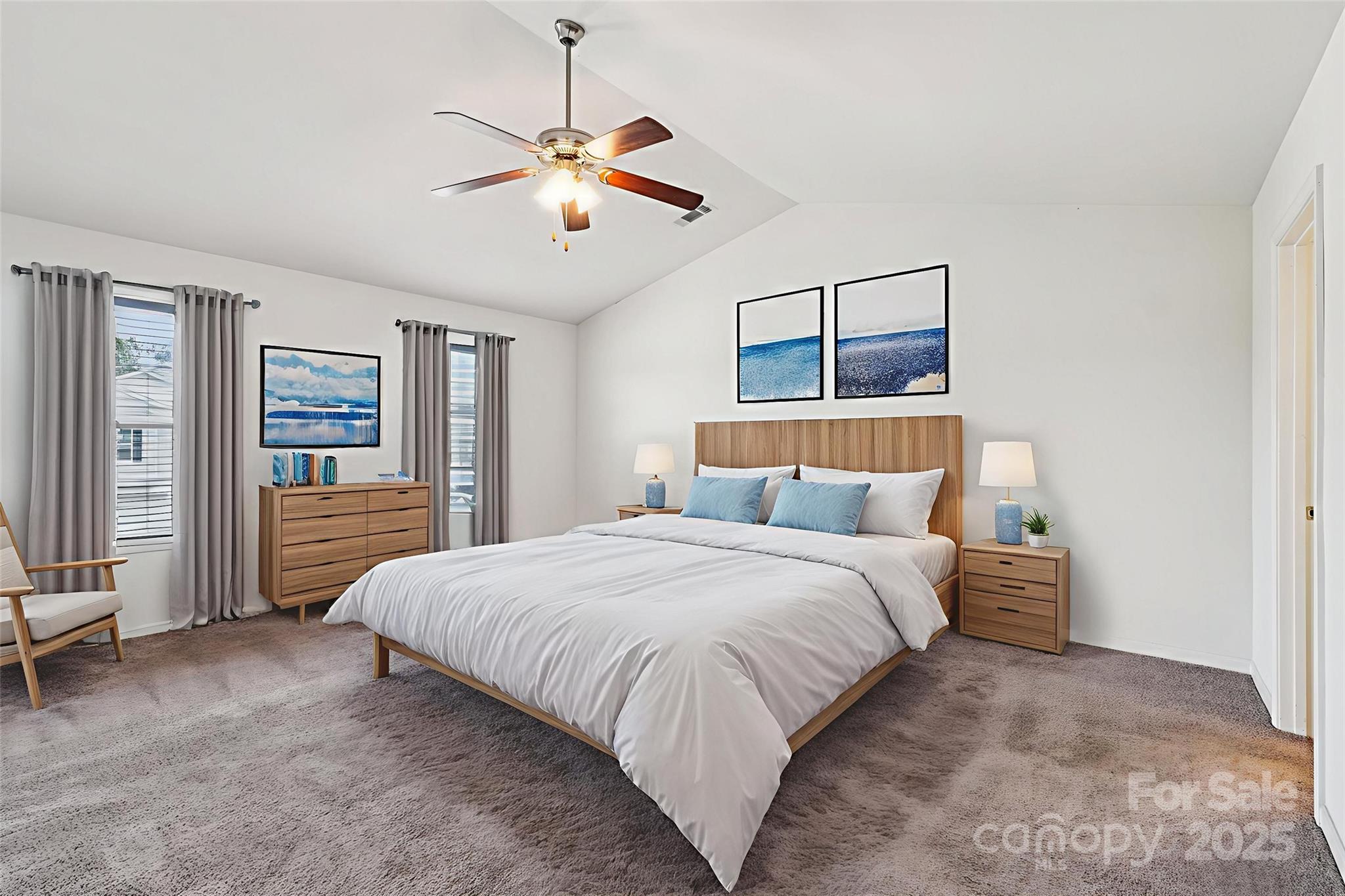 2289 Reid Pointe Avenue Indian Land, SC 29707 - Photo 21 of 39 a bedroom with a large bed and ceiling fan