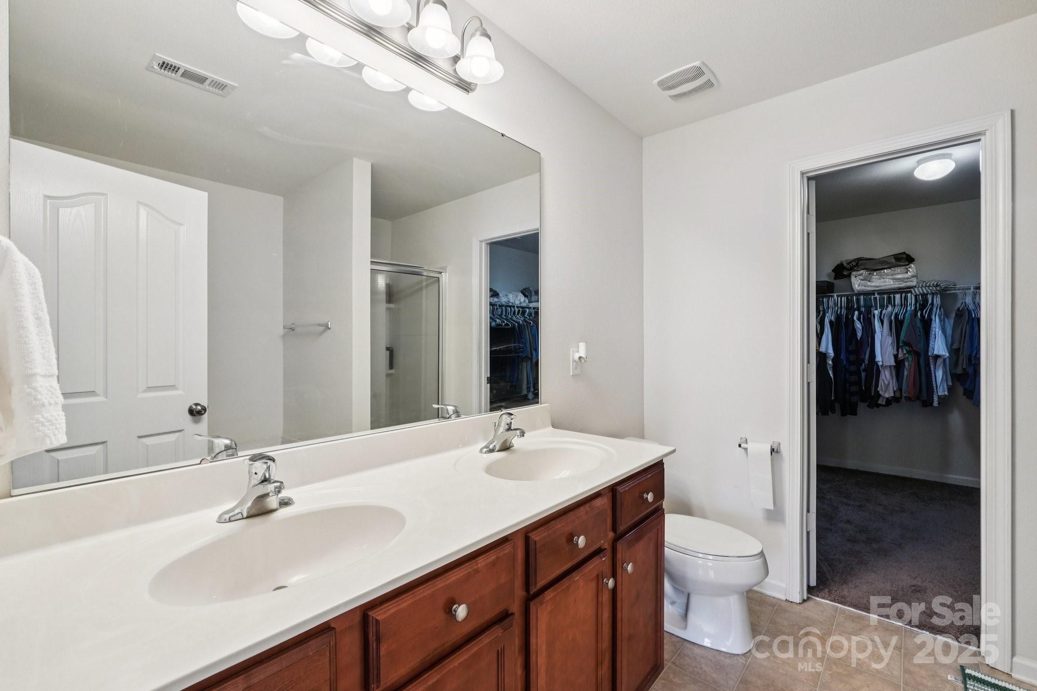2289 Reid Pointe Avenue Indian Land, SC 29707 - Photo 24 of 39 a bathroom with a sink a toilet and shower