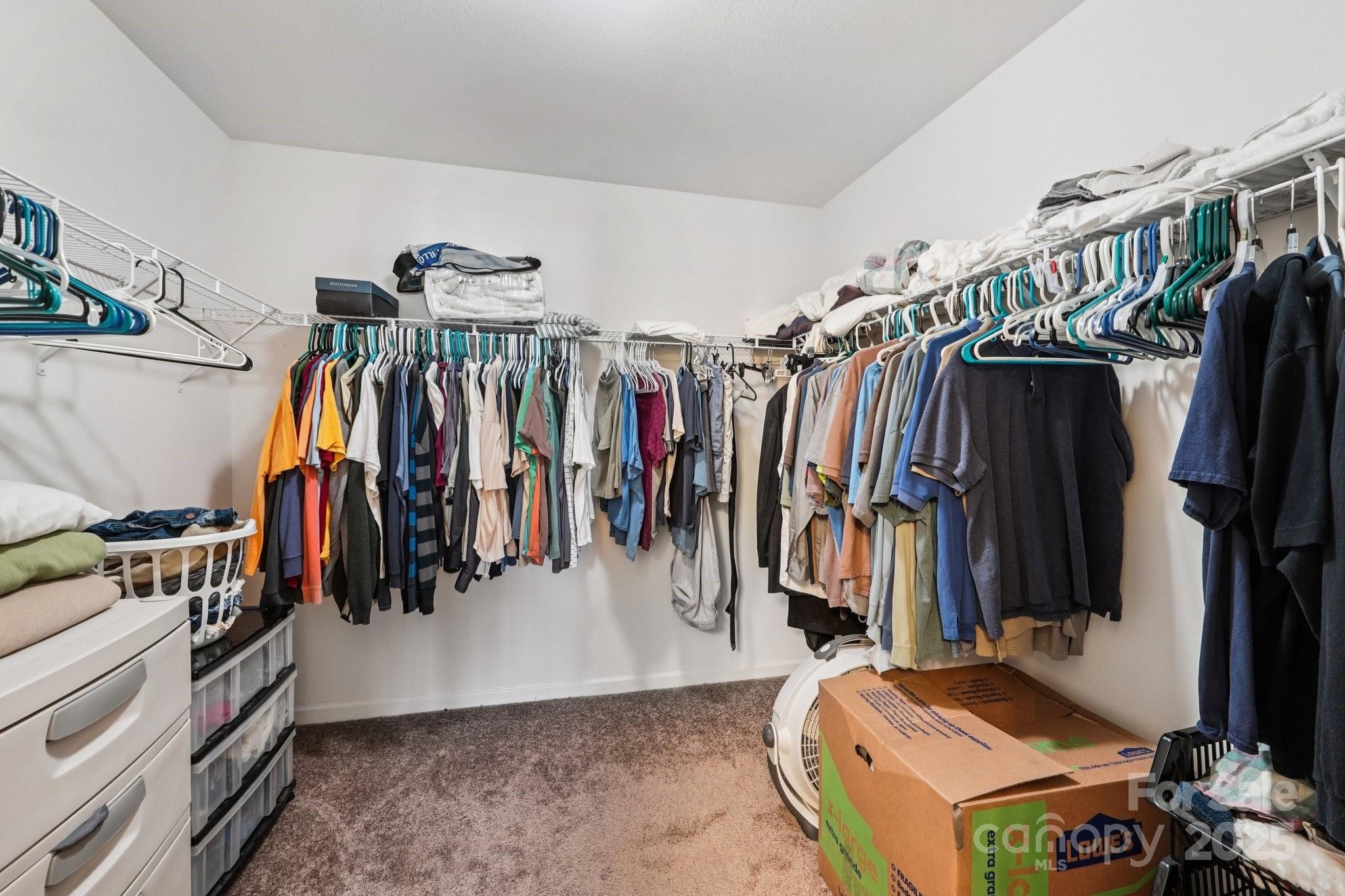 2289 Reid Pointe Avenue Indian Land, SC 29707 - Photo 26 of 39 a view of walk in closet with clothes