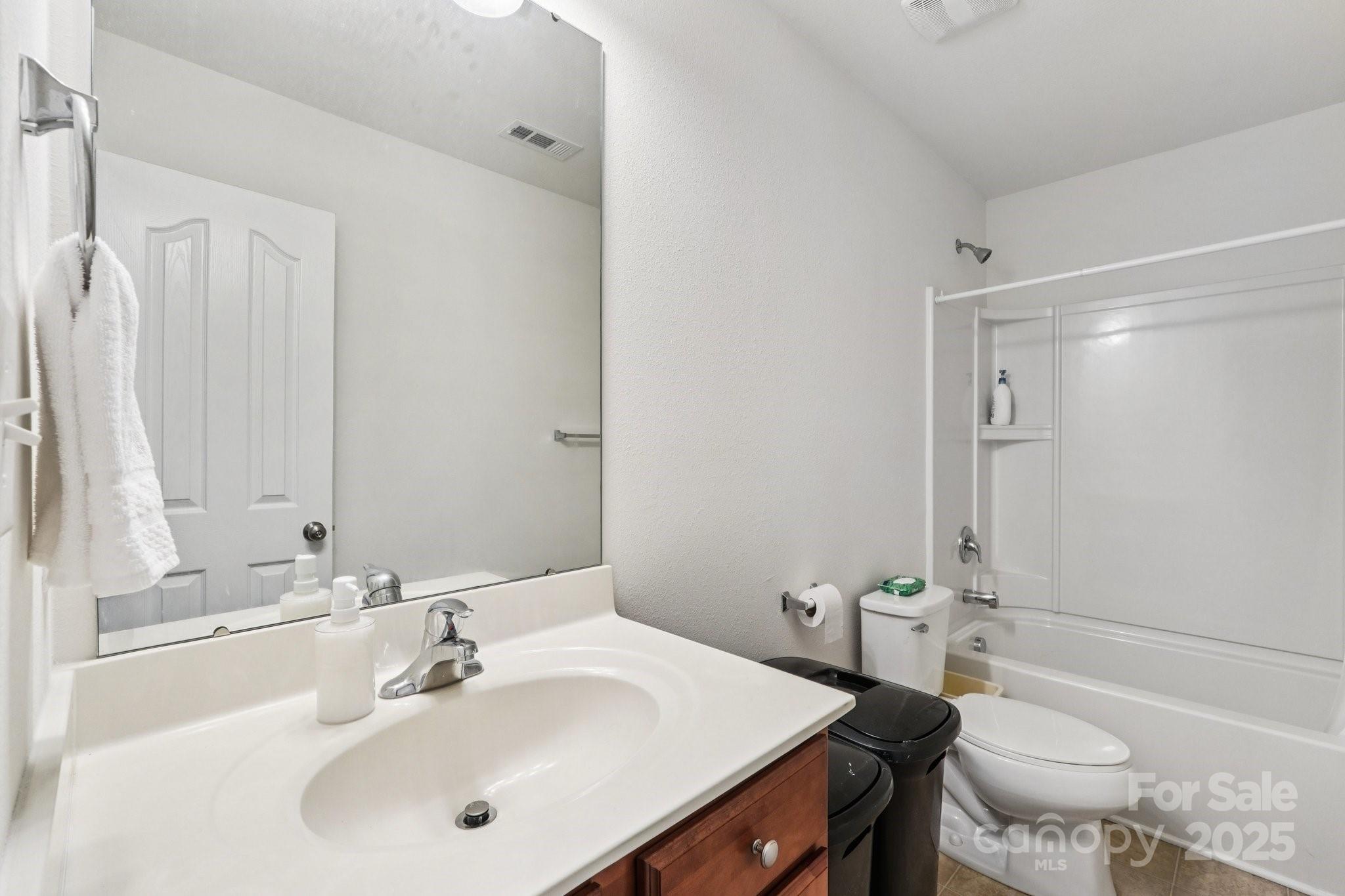 2289 Reid Pointe Avenue Indian Land, SC 29707 - Photo 30 of 39 a bathroom with a sink toilet and shower