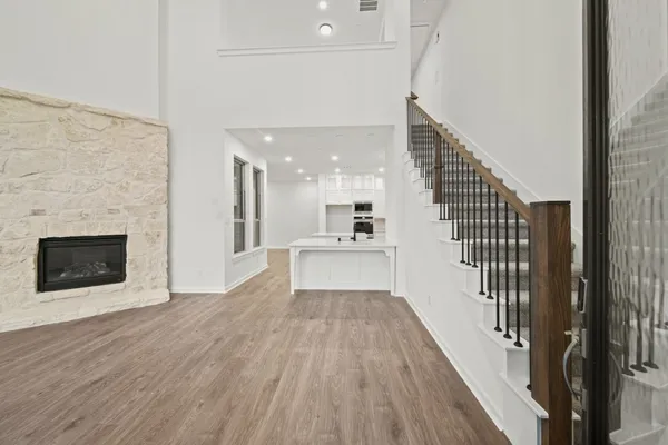 a kitchen with stainless steel appliances a sink stove and cabinets