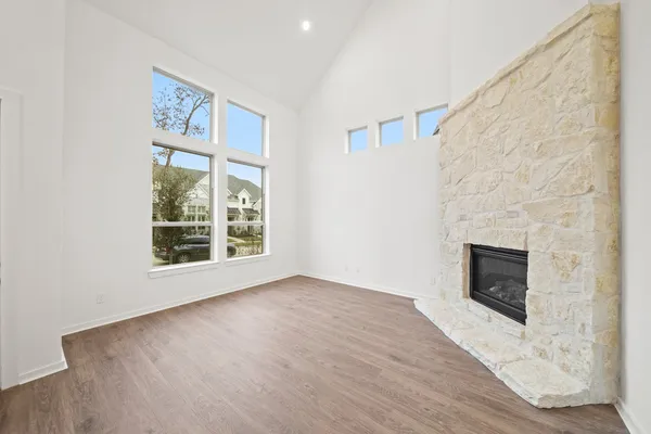 a bedroom with a bed and a potted plant
