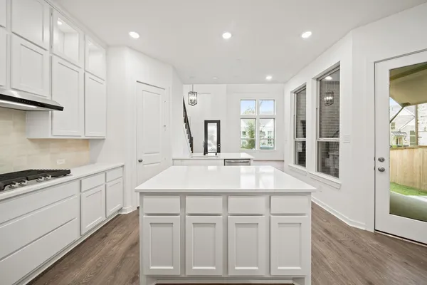 a spacious bathroom with a bathtub shower sink double and mirror