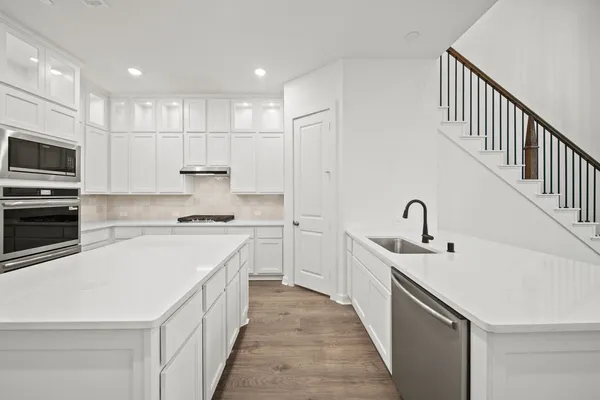 a bathroom with a double vanity sink a mirror and a shower