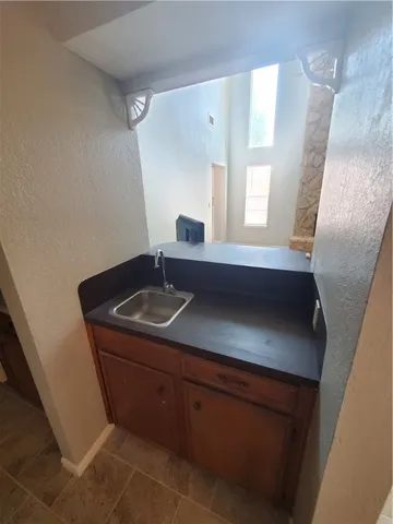 a sink sitting next to a bathroom sink