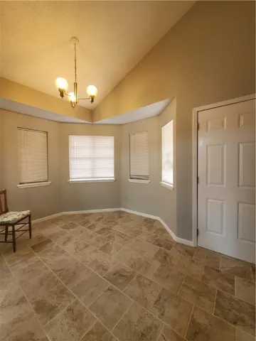 a view of an empty room and window