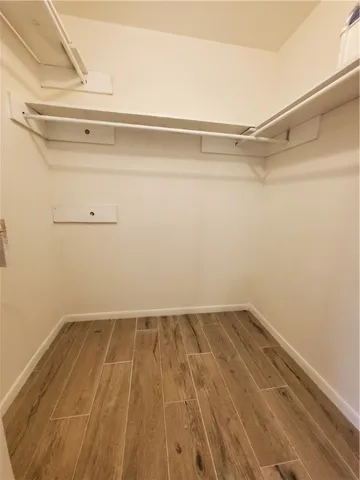 a view of a room with racks on the wall