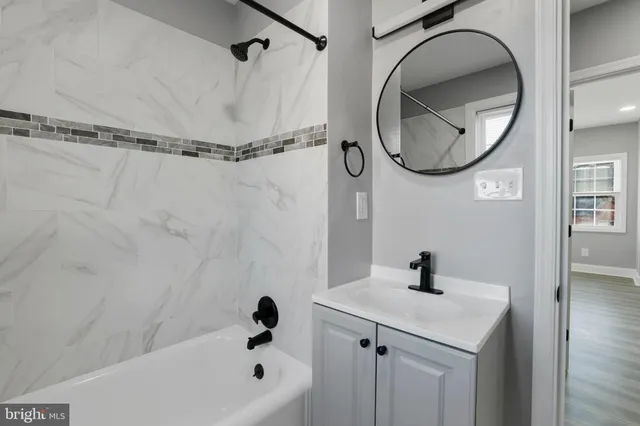a bathroom with a sink a vanity and a mirror