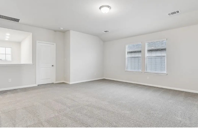 163 Pendleton Drive Kyle, TX 78640 - Photo 11 of 15 an empty room with windows