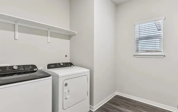 a utility room with dryer and washer