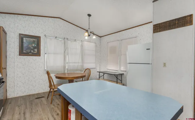 a view of a dining room with furniture