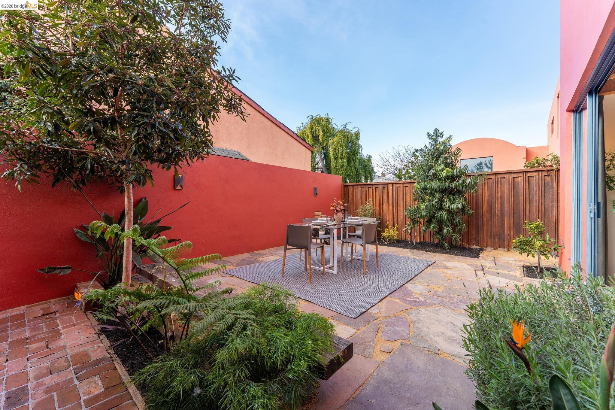 2015 Delaware Street, Unit A Berkeley, CA 94709 - Photo 19 of 60 a view of a backyard with sitting area