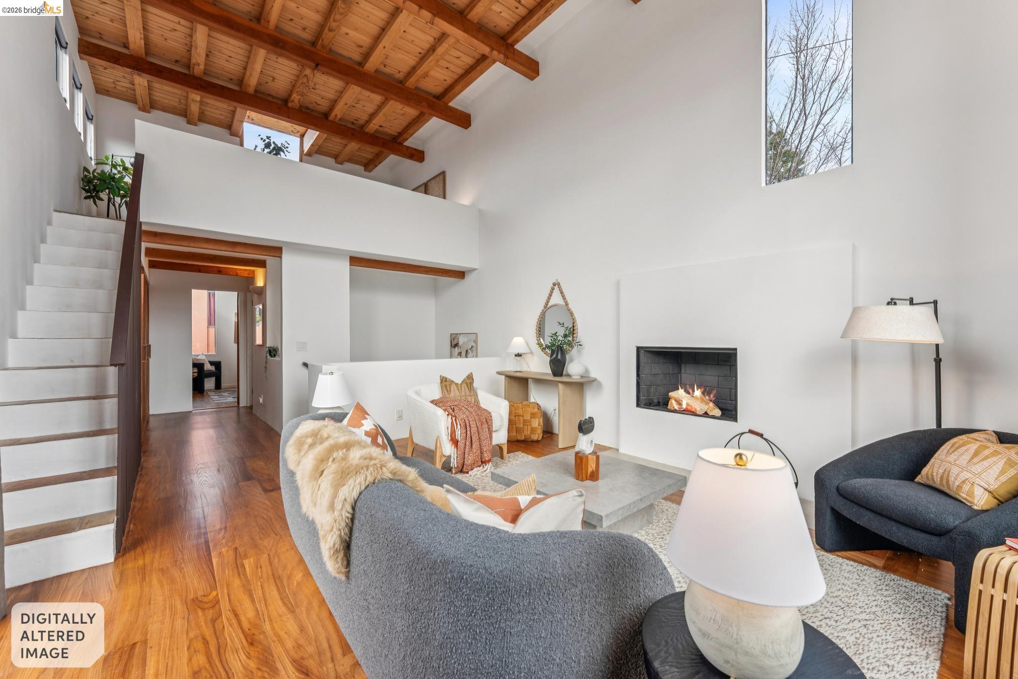 2015 Delaware Street, Unit A Berkeley, CA 94709 - Photo 24 of 60 a living room with furniture and a fireplace