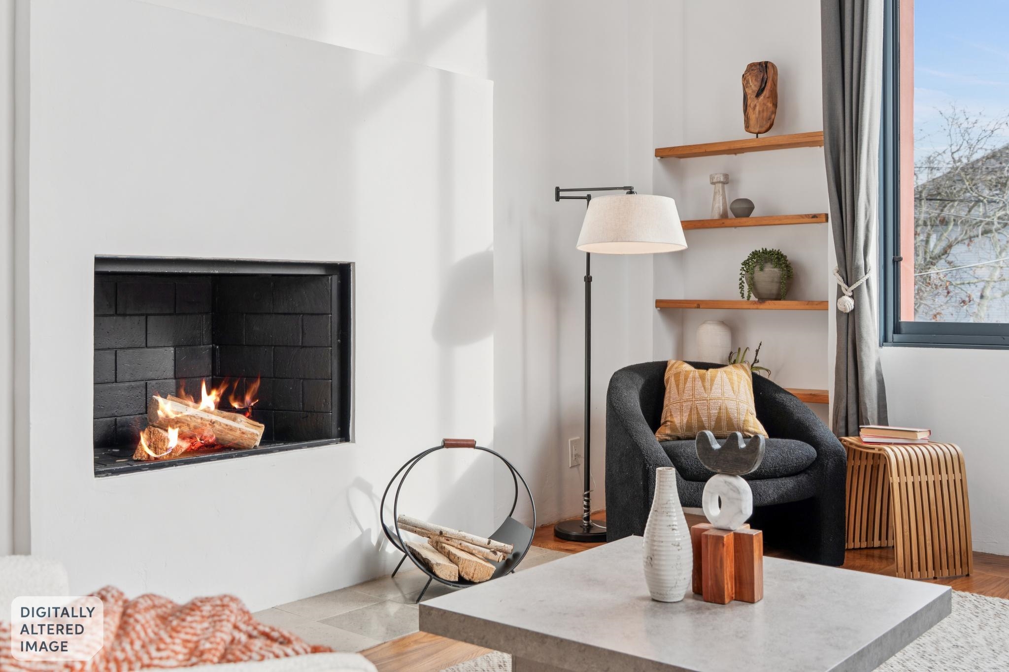 2015 Delaware Street, Unit A Berkeley, CA 94709 - Photo 25 of 59 Sitting room with a lit fireplace and radiator