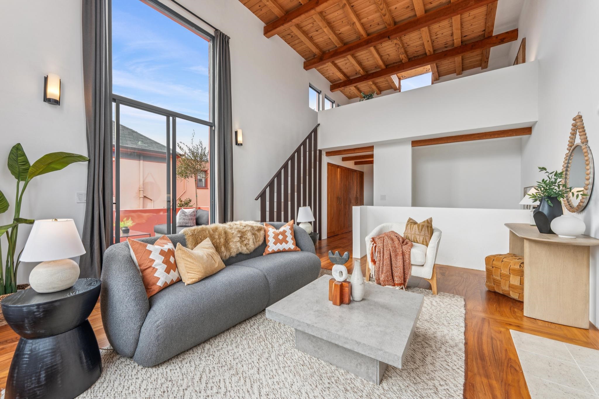 2015 Delaware Street, Unit A Berkeley, CA 94709 - Photo 30 of 59 Living room featuring parquet flooring and a high wooden beamed ceiling