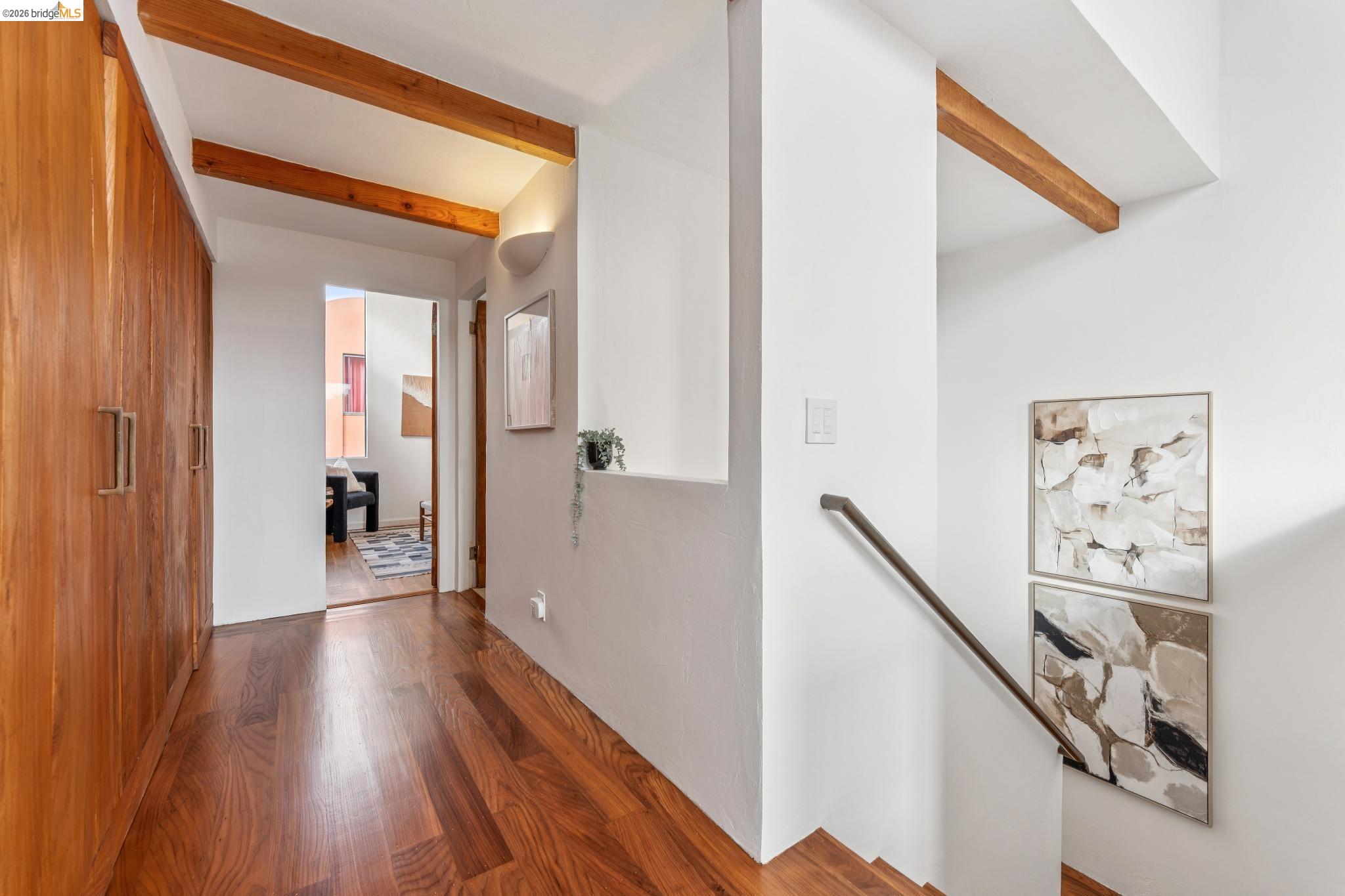 2015 Delaware Street, Unit A Berkeley, CA 94709 - Photo 36 of 60 a view of a hallway with wooden floor and stairs