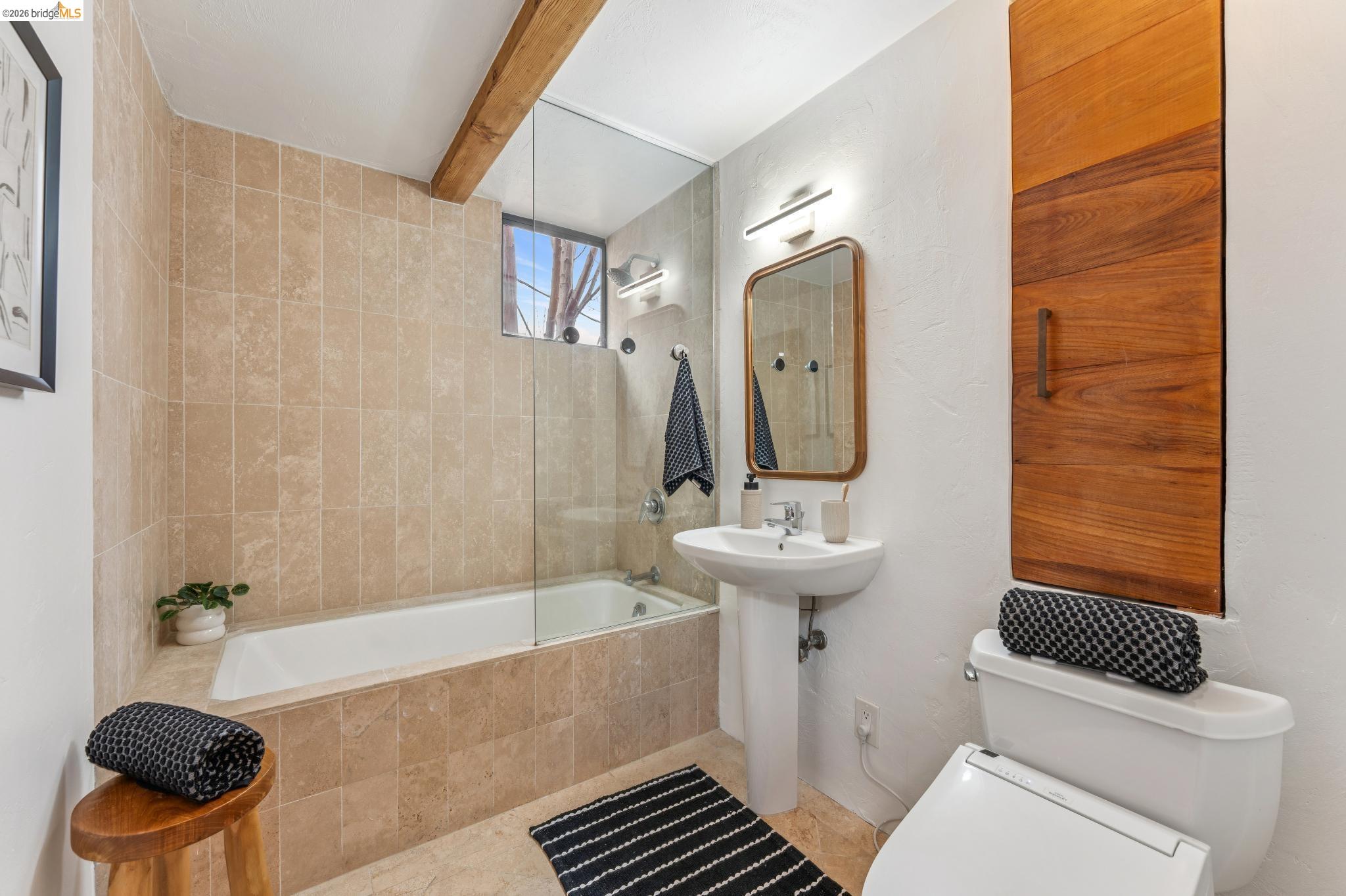 2015 Delaware Street, Unit A Berkeley, CA 94709 - Photo 42 of 60 a bathroom with a sink a toilet and shower
