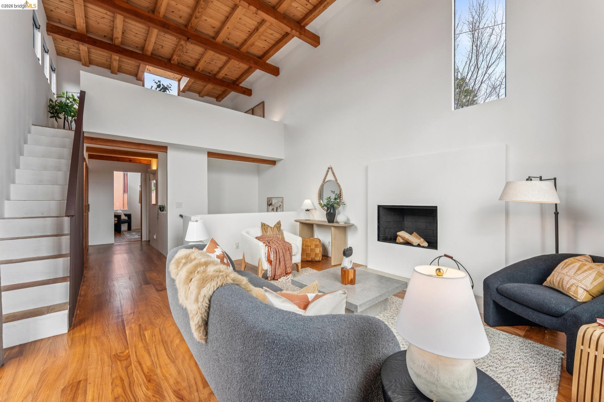 2015 Delaware Street, Unit A Berkeley, CA 94709 - Photo 44 of 60 a living room with furniture and a fireplace