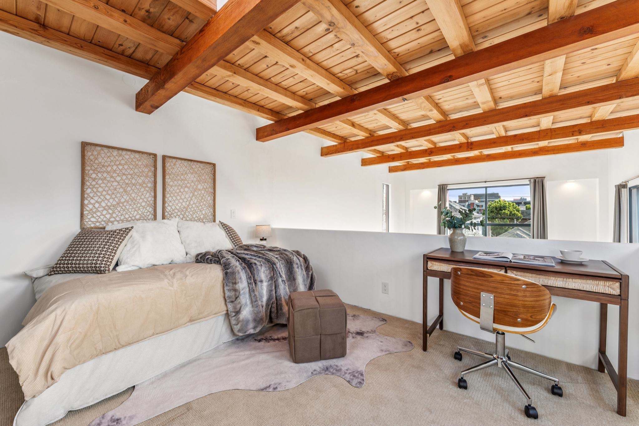 2015 Delaware Street, Unit A Berkeley, CA 94709 - Photo 45 of 59 Carpeted bedroom featuring an office area and a wooden ceiling with exposed beams