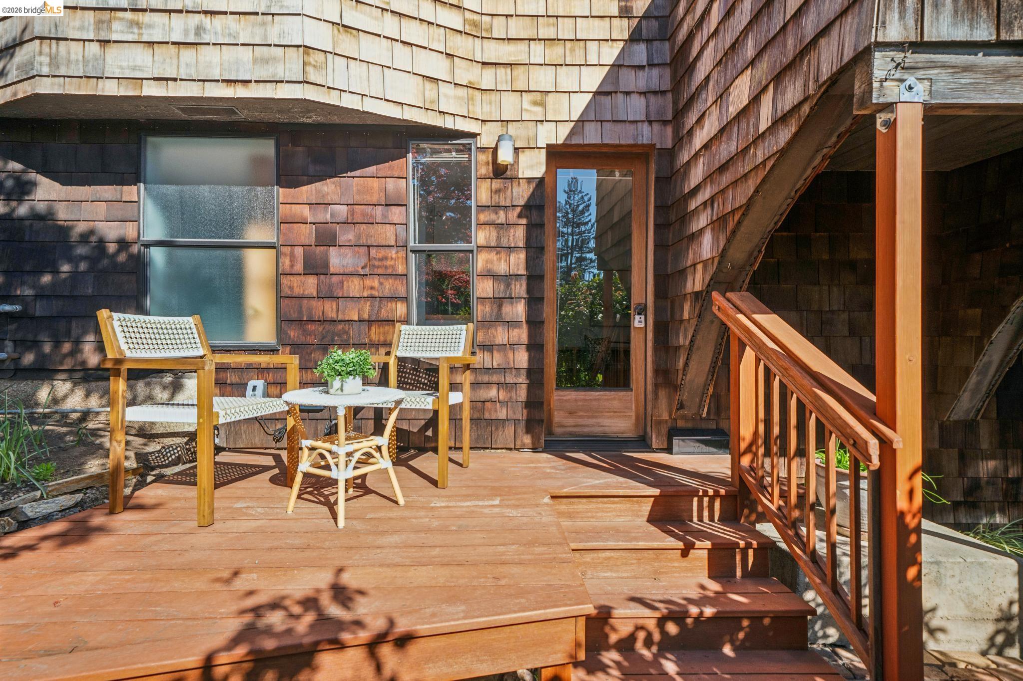 813 San Diego Road Berkeley, CA 94707 - Photo 53 of 60 a view of a patio with table and chairs with wooden floor and fence