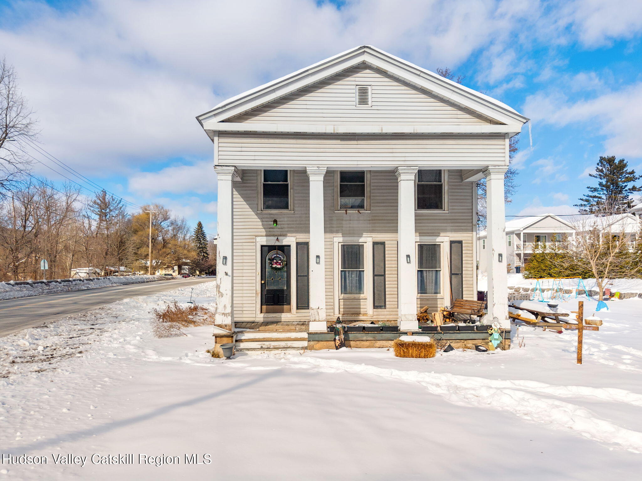 103 Middlefort Road Middleburgh, NY 12122 - Photo 1 of 14 a view of a house with snow on the road