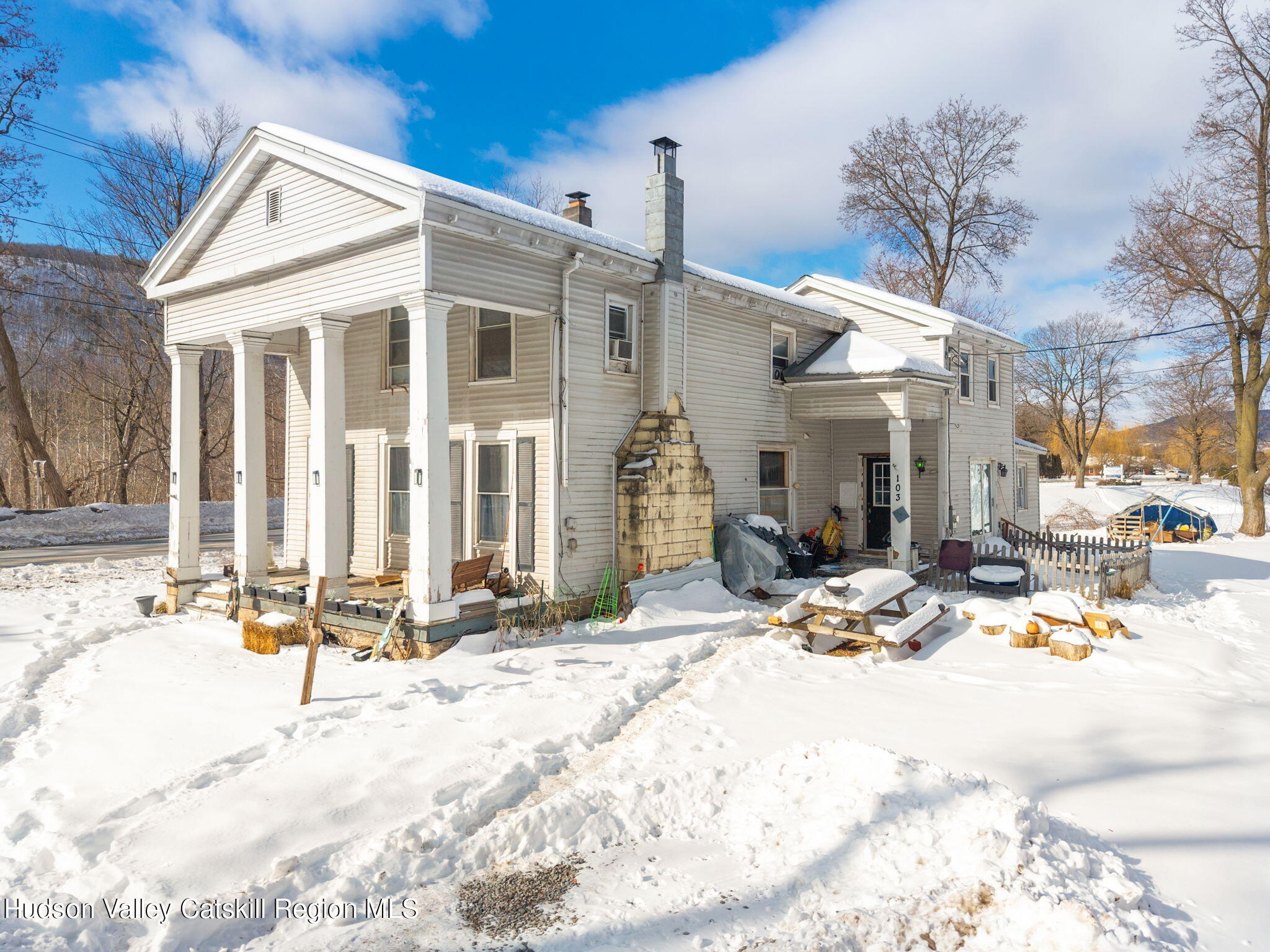 103 Middlefort Road Middleburgh, NY 12122 - Photo 2 of 14 a view of a building with snow on the road