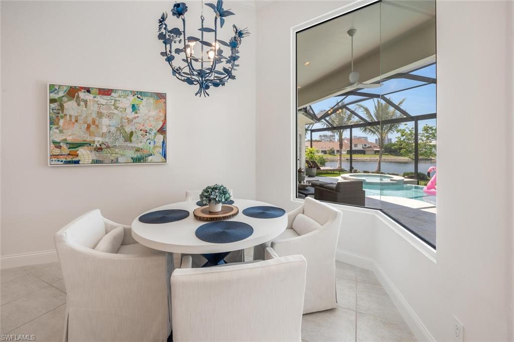 4129 Willowhead Way Naples, FL 34103 - Photo 13 of 50 a dining room with furniture and window