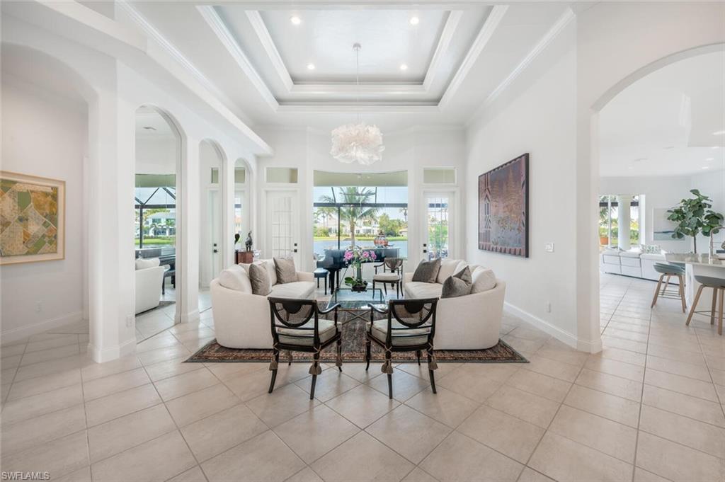 4129 Willowhead Way Naples, FL 34103 - Photo 3 of 50 a dining room with furniture and wooden floor
