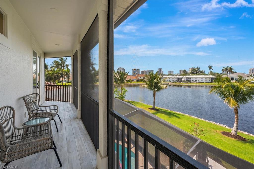 4129 Willowhead Way Naples, FL 34103 - Photo 37 of 50 a view of a balcony with furniture