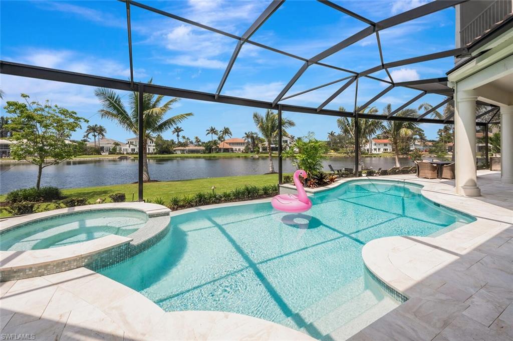 4129 Willowhead Way Naples, FL 34103 - Photo 38 of 50 a view of a swimming pool with a patio