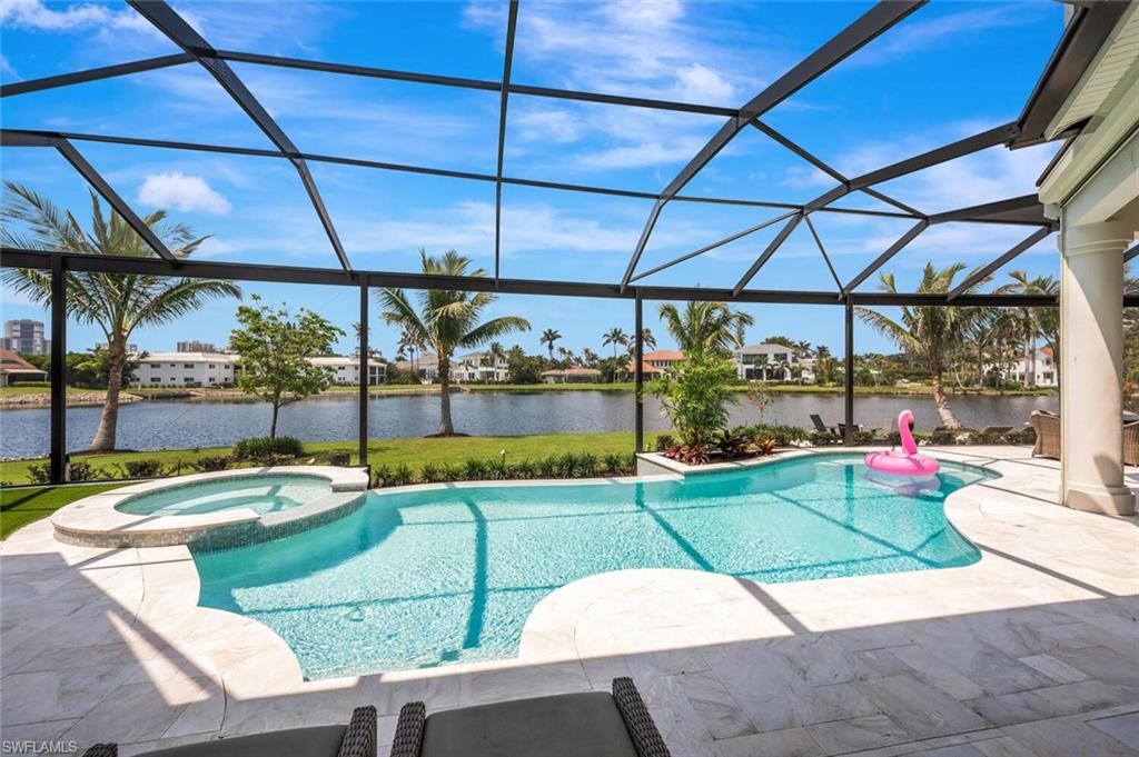4129 Willowhead Way Naples, FL 34103 - Photo 39 of 50 a view of a swimming pool with a patio