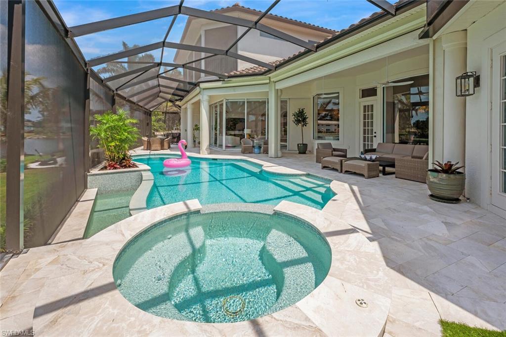 4129 Willowhead Way Naples, FL 34103 - Photo 40 of 50 a view of a swimming pool with a porch and furniture