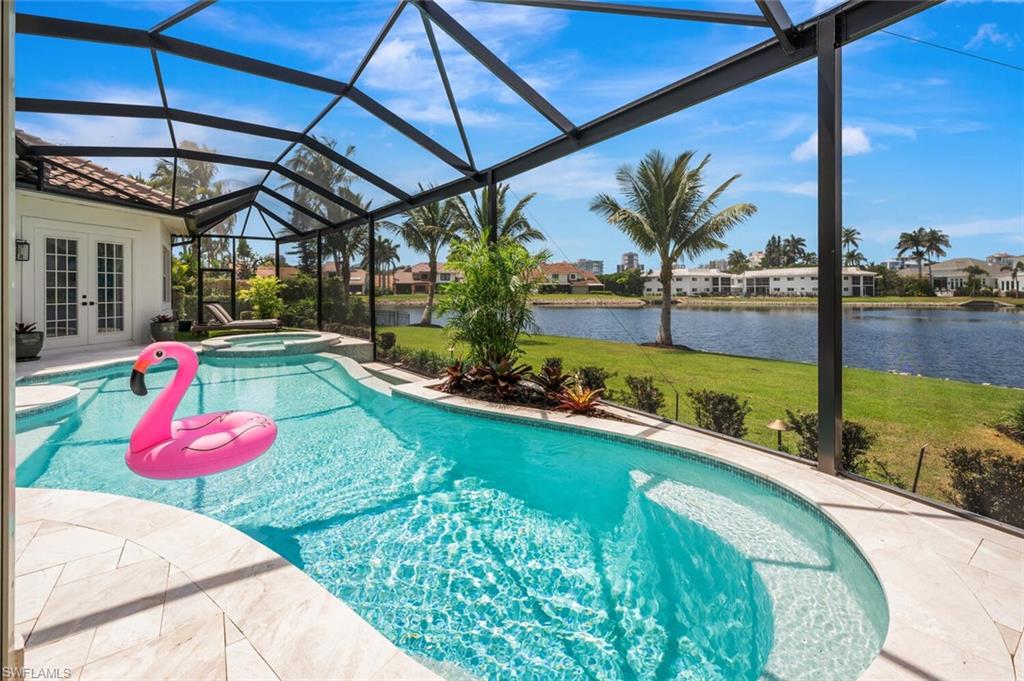 4129 Willowhead Way Naples, FL 34103 - Photo 41 of 50 a view of swimming pool with a patio and a fountain