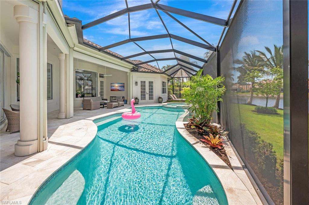 4129 Willowhead Way Naples, FL 34103 - Photo 42 of 50 a front view of a house with a yard