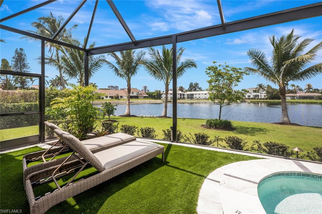 4129 Willowhead Way Naples, FL 34103 - Photo 45 of 50 a view of a backyard with couches potted plants