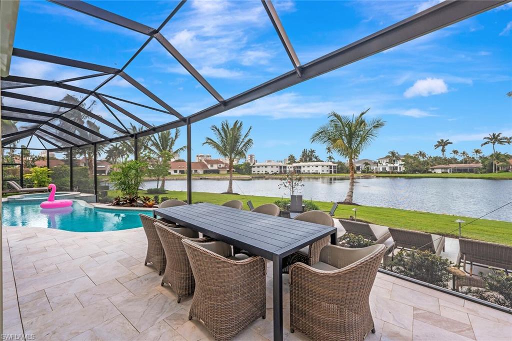4129 Willowhead Way Naples, FL 34103 - Photo 47 of 50 a view of a backyard with sitting area